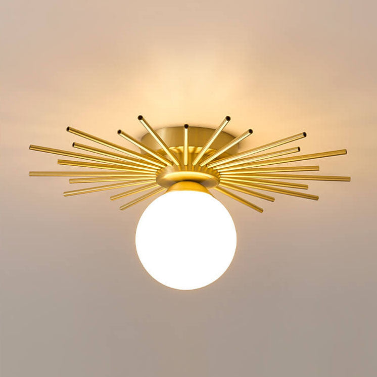 Suspension soleil dorée design avec globe en verre