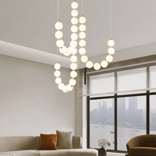 Suspension design luxe à globes lumineux dorés