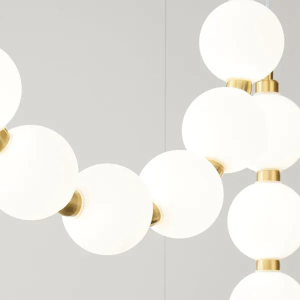 Suspension design luxe à globes lumineux dorés