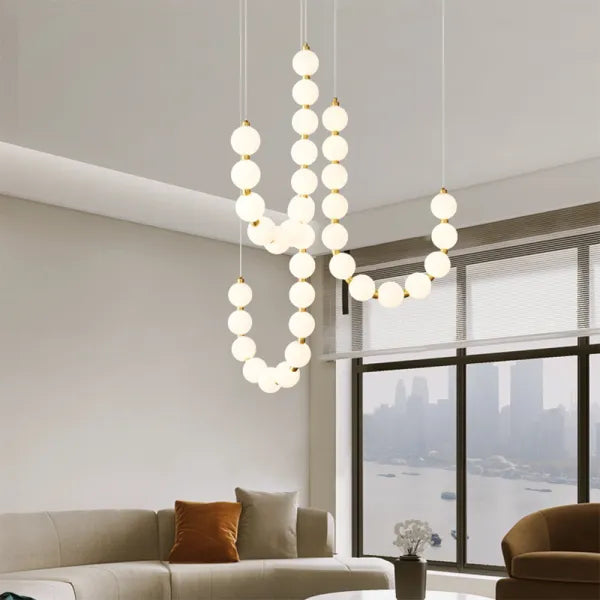 Suspension design luxe à globes lumineux dorés