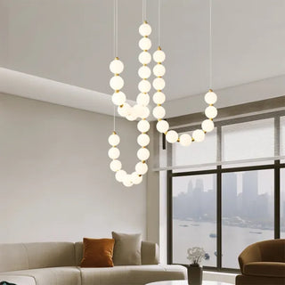 Suspension design luxe à globes lumineux dorés