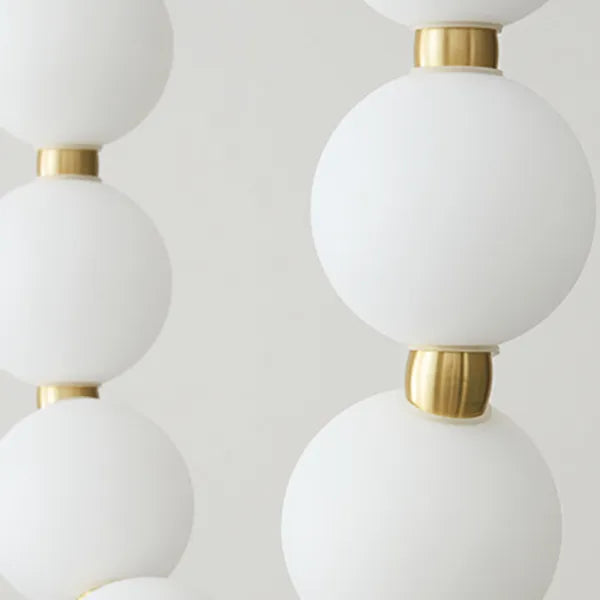 Suspension design luxe à globes lumineux dorés