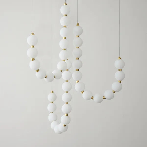 Suspension design luxe à globes lumineux dorés