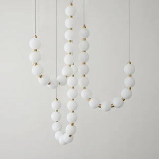 Suspension design luxe à globes lumineux dorés
