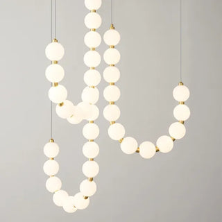 Suspension design luxe à globes lumineux dorés
