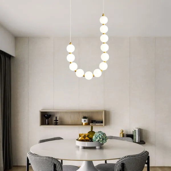 Suspension design luxe à globes lumineux dorés