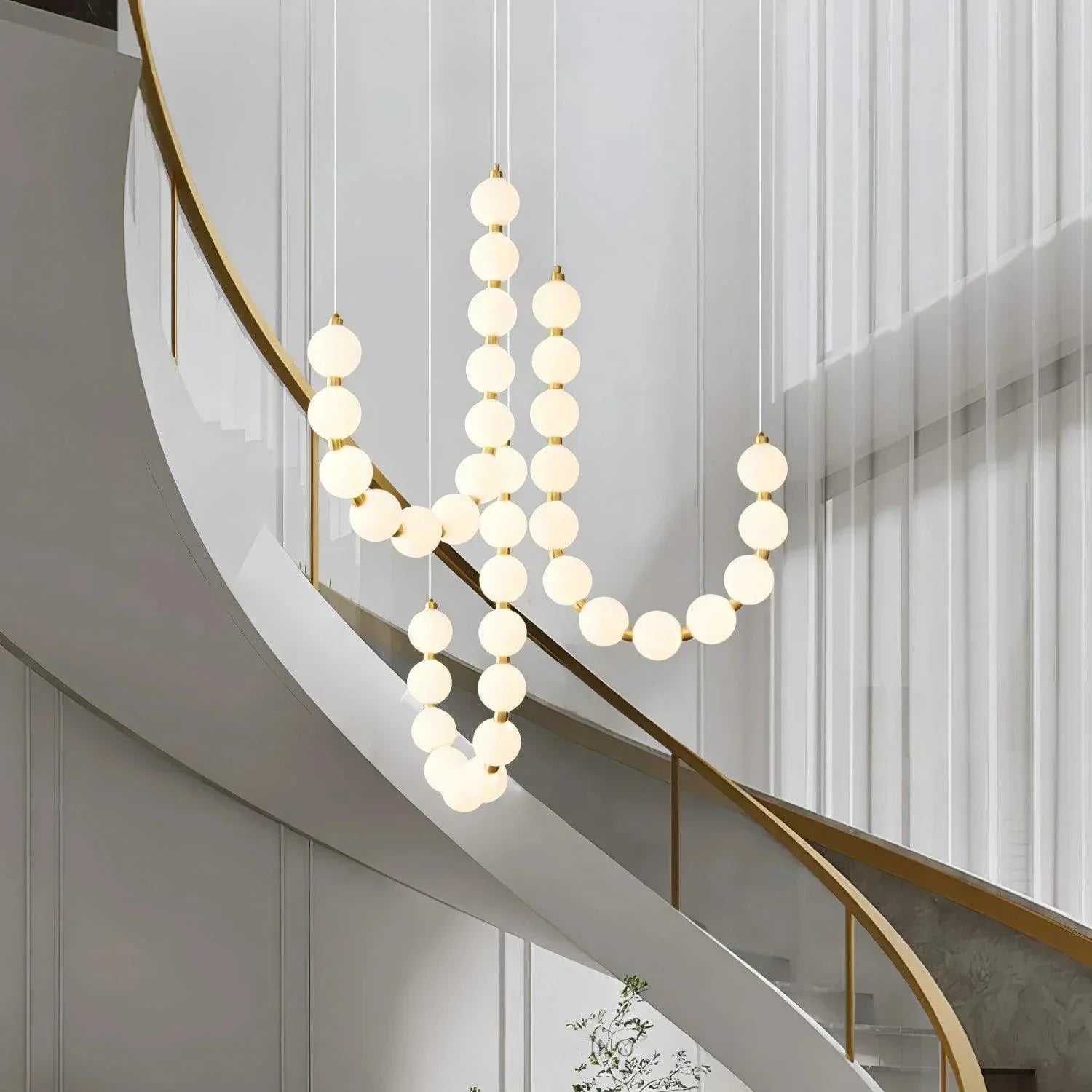Suspension design luxe à globes lumineux dorés