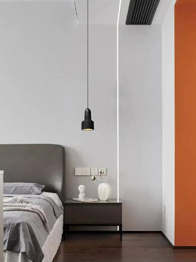 Suspension design minimaliste en pierre volcanique noire